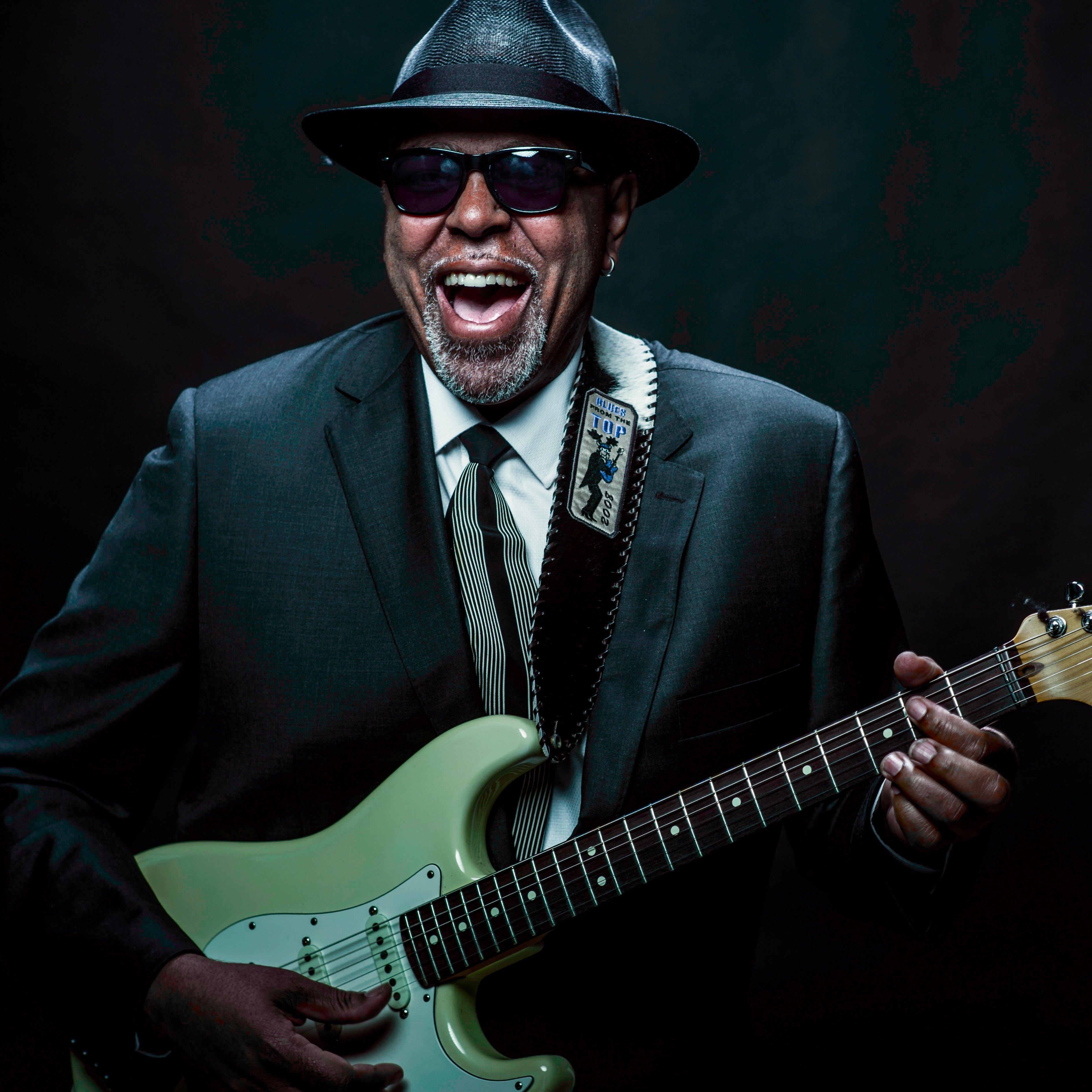 man performing with guitar