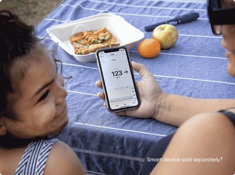 Mother and Daughter Showing Dexcom Follow App on their phones