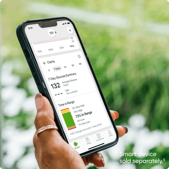 hand holding smart phone with dexcom app screen