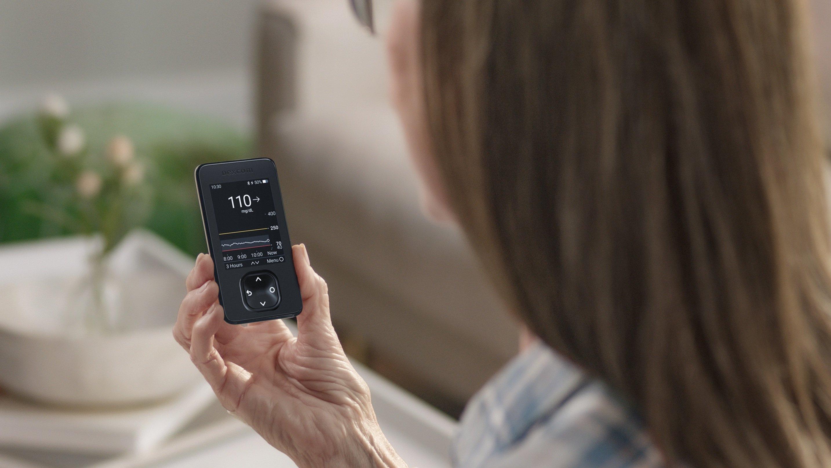 G6 smartphone app screen beside receiver