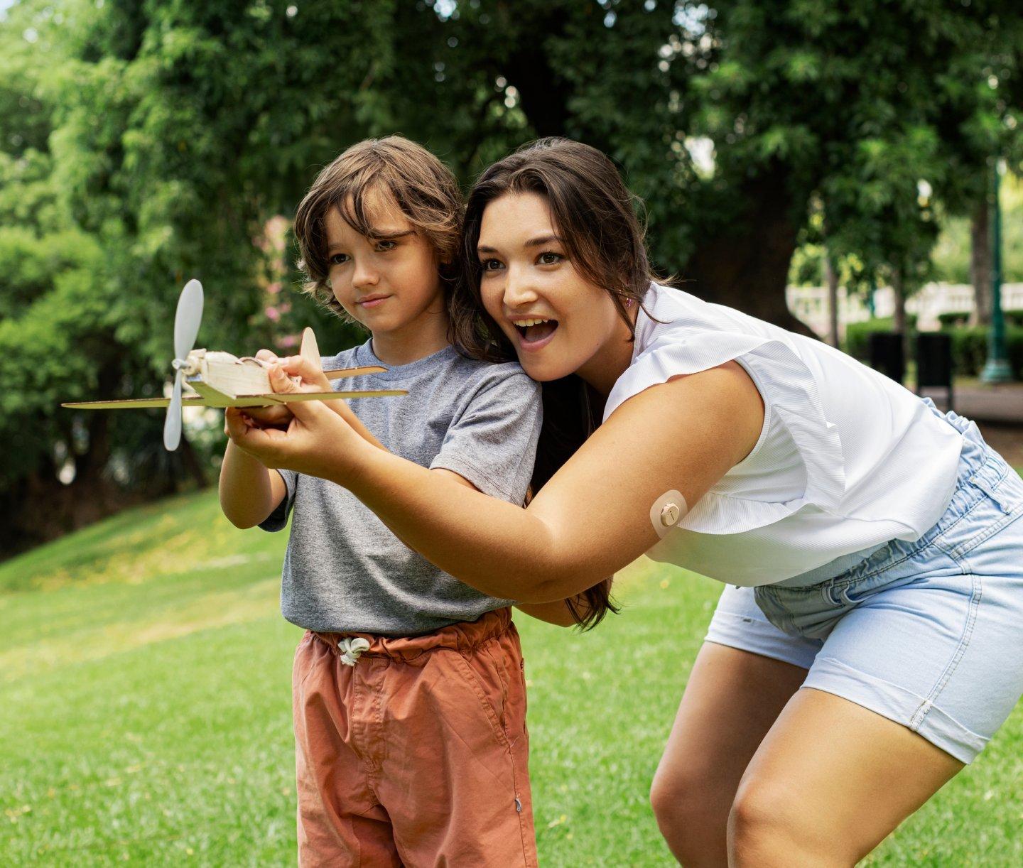 mom and son playing outdoors