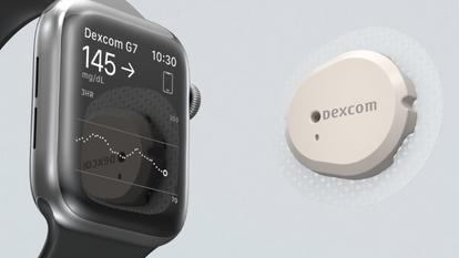 smartwatch with dexcom screen displayed facing dexcom sensor