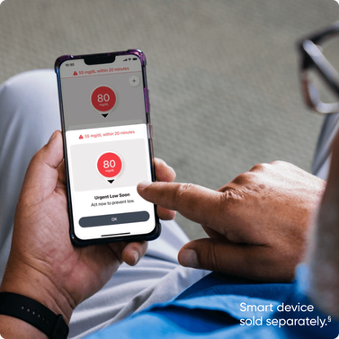 phone screen showing urgent low alert on dexcom app