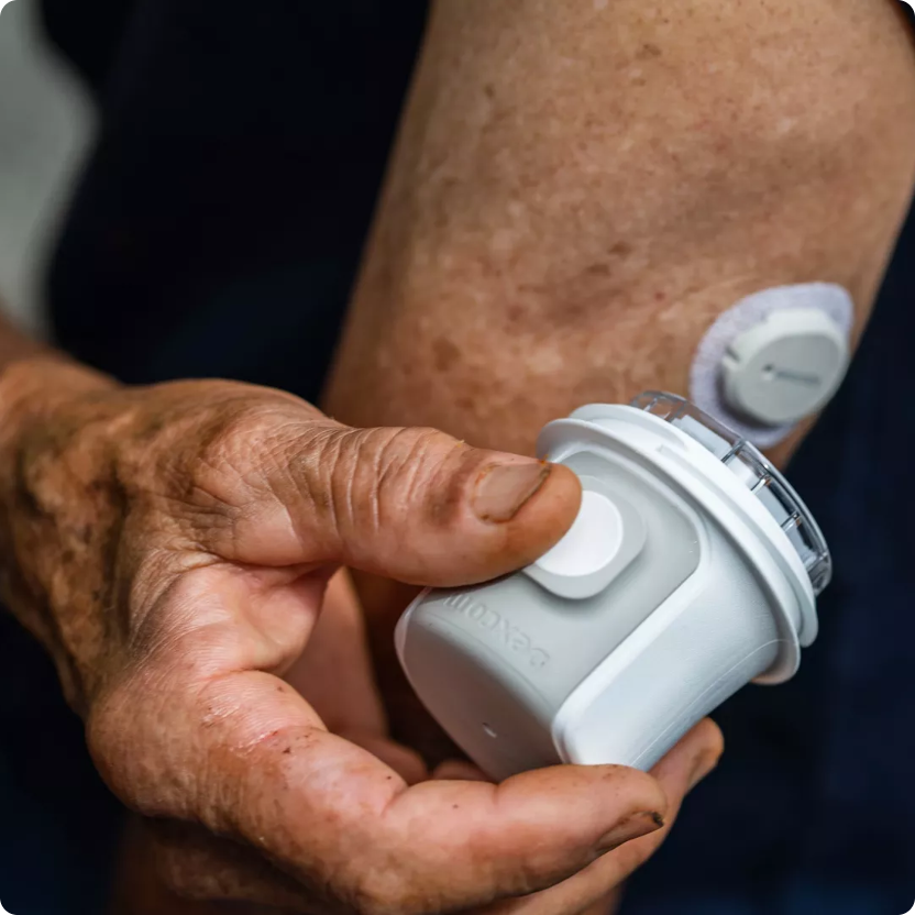 Man in kitchen looking at phone