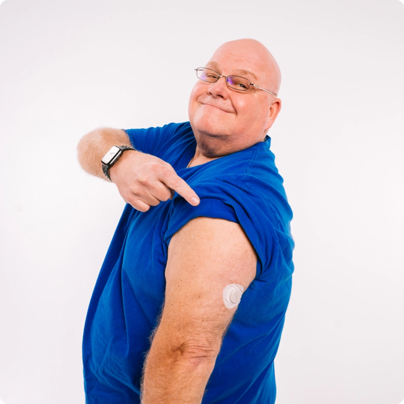 Dexcom sensor applied to a man's abdomen