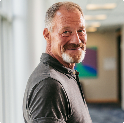 man smiling looking at camera