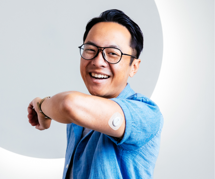 man smiling wearing dexcom