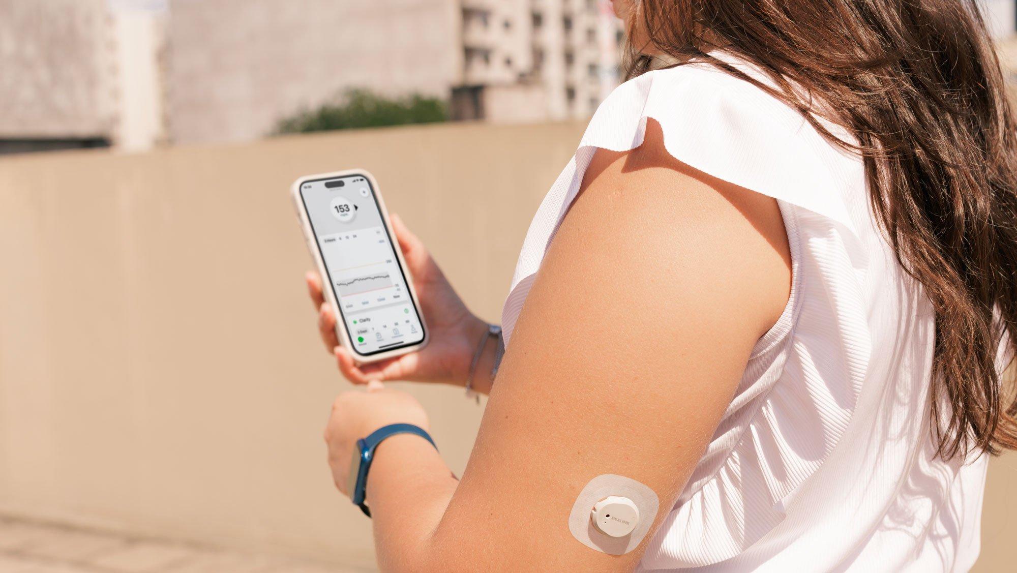 man looking at smart device