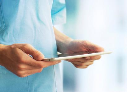 Hospital person holding tablet