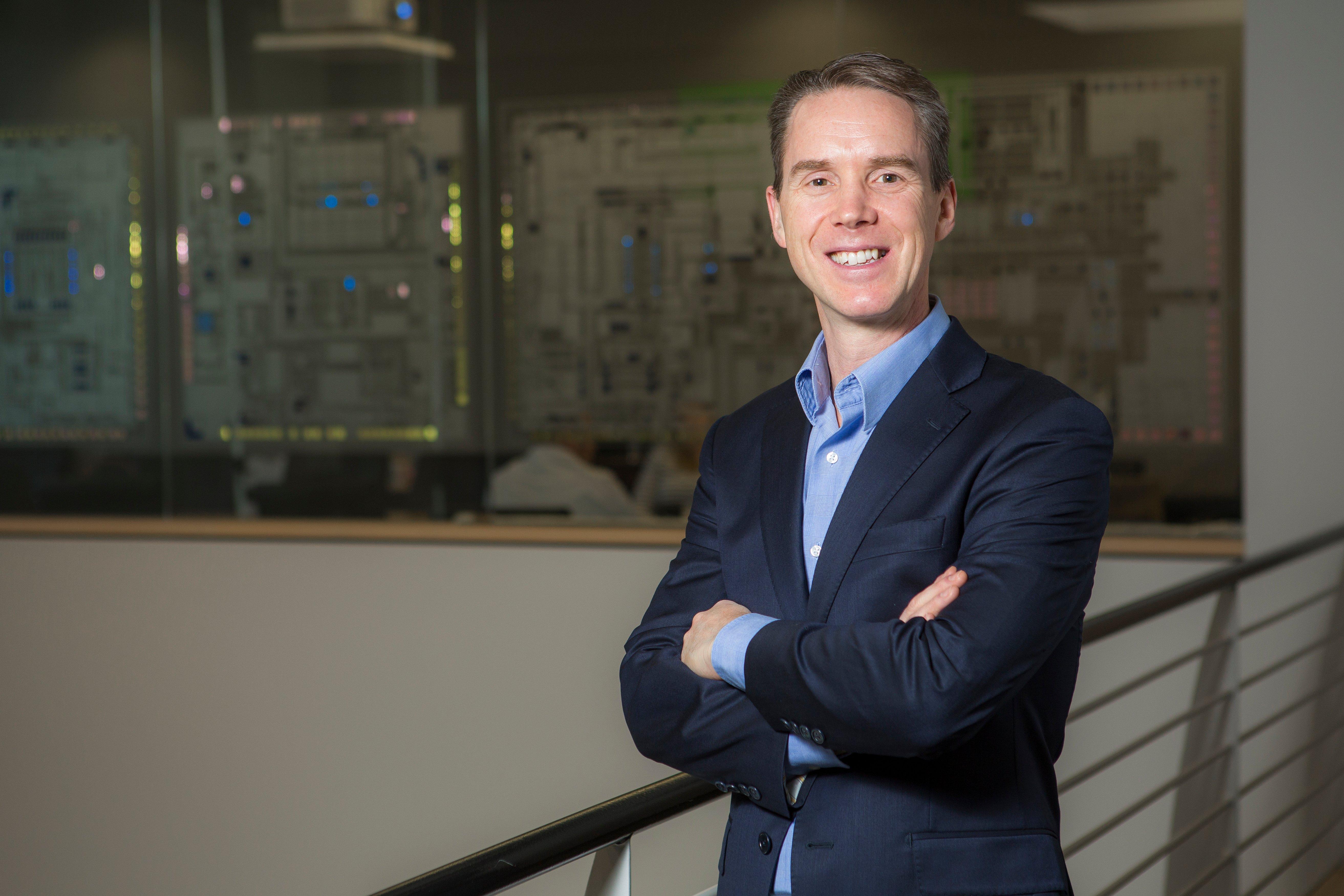 Headshot of Paul Flynn with his arms crossed