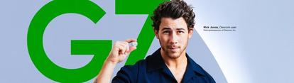 Nick Jonas, Dexcom Spokesperson, holding a Dexcom g7 Seonsor