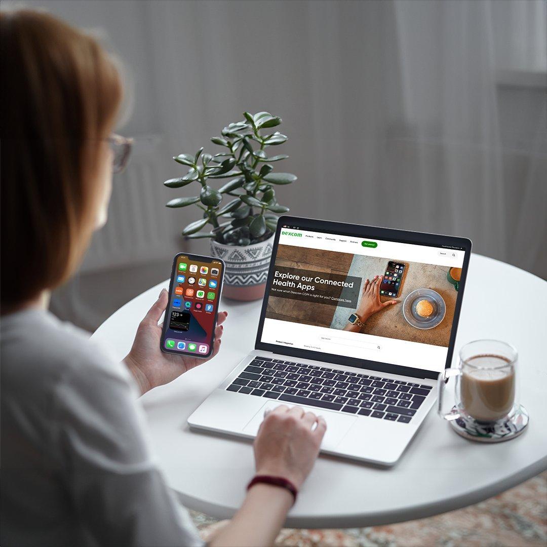 woman holding phone with happybob screen