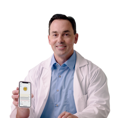 Dr. Michael Helle, T1D Endocrinologist showing Dexcom G6 CGM on mobile phone