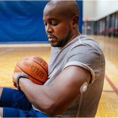 Man on court checking watch