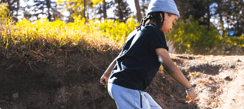 Boy running outdoors