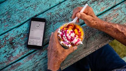 acai bowl and dexcom app on smart phone sitting on table