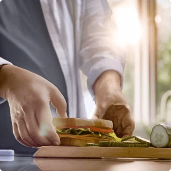 sandwich being grabbed by hands