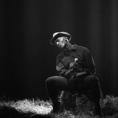 man singing seated