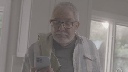 man looking at smartphone