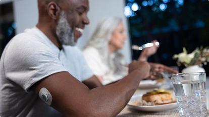 man eating Dinner while wearing the sensor