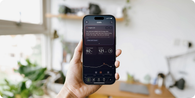 Stelo app on smartphone held by a hand