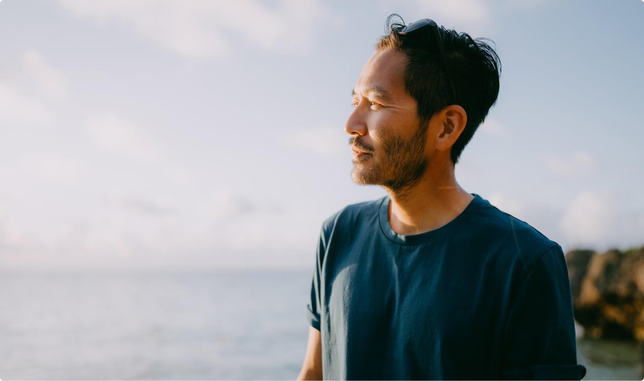 Man looking out over water
