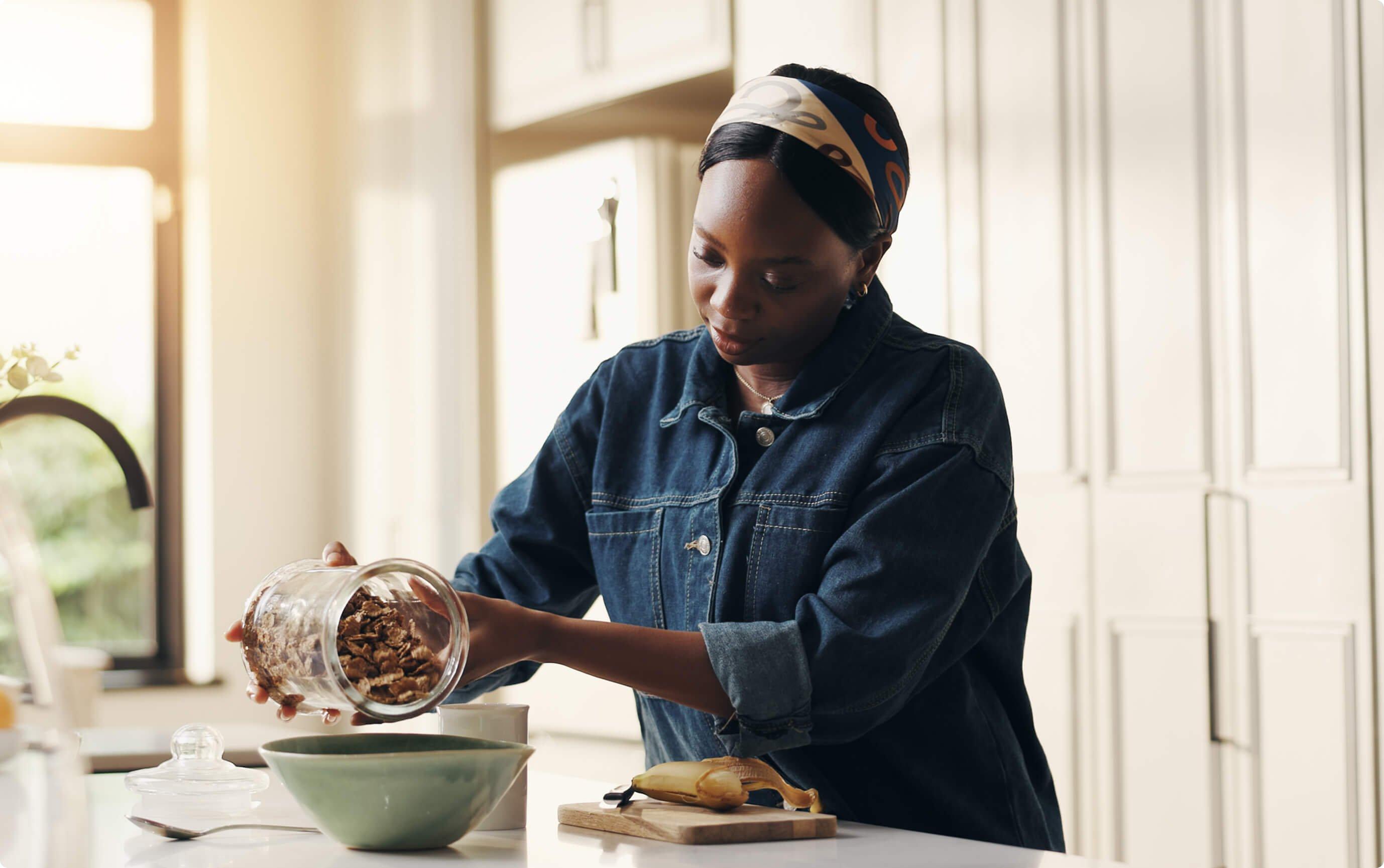 Woman pouring cereal into a bowl