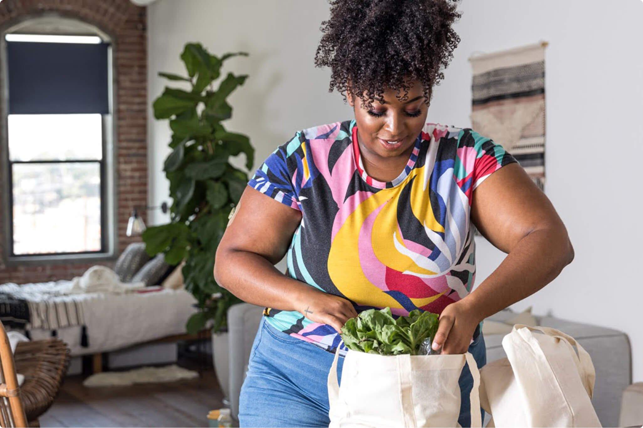 Woman unpacking her grocery bag