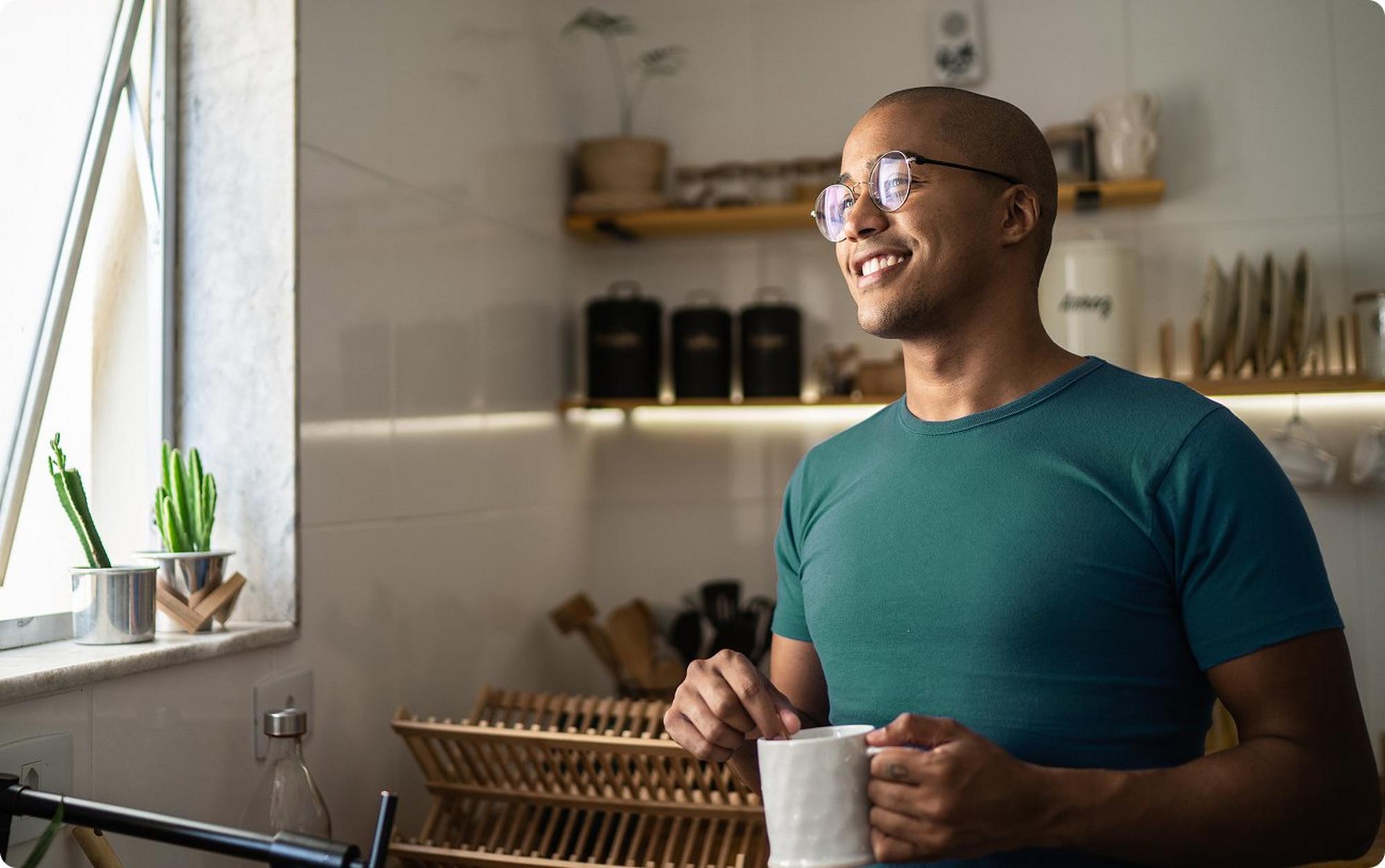smiling man holding mug
