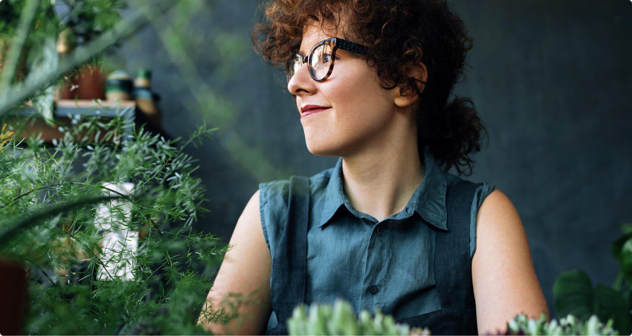 Woman wearing glasses looking to the left