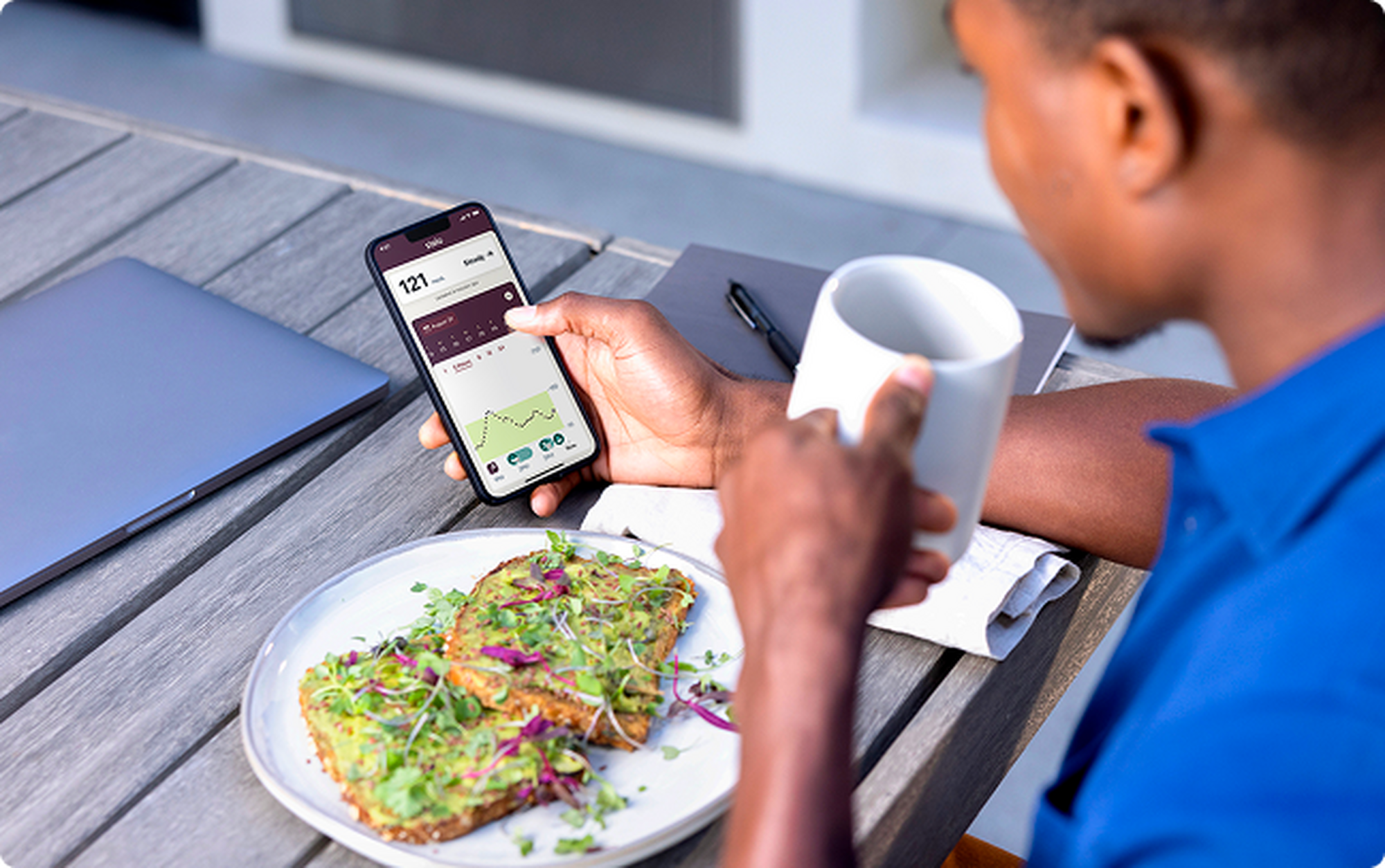 Man looking at readings on his phone