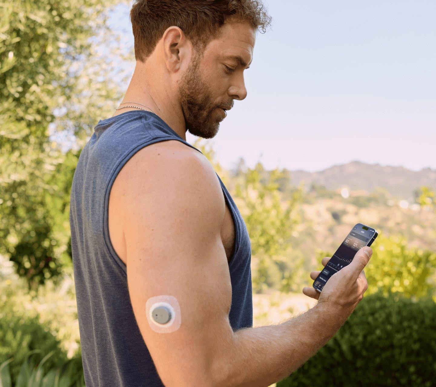 Man walking outside while wearing Stelo sensor