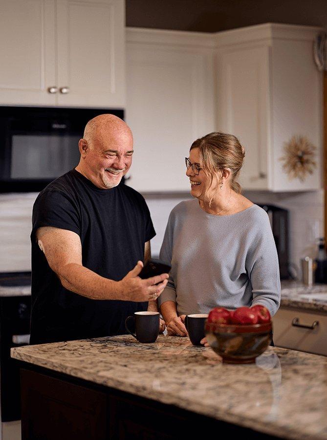 Dean  showing glucose readings in the kitchen