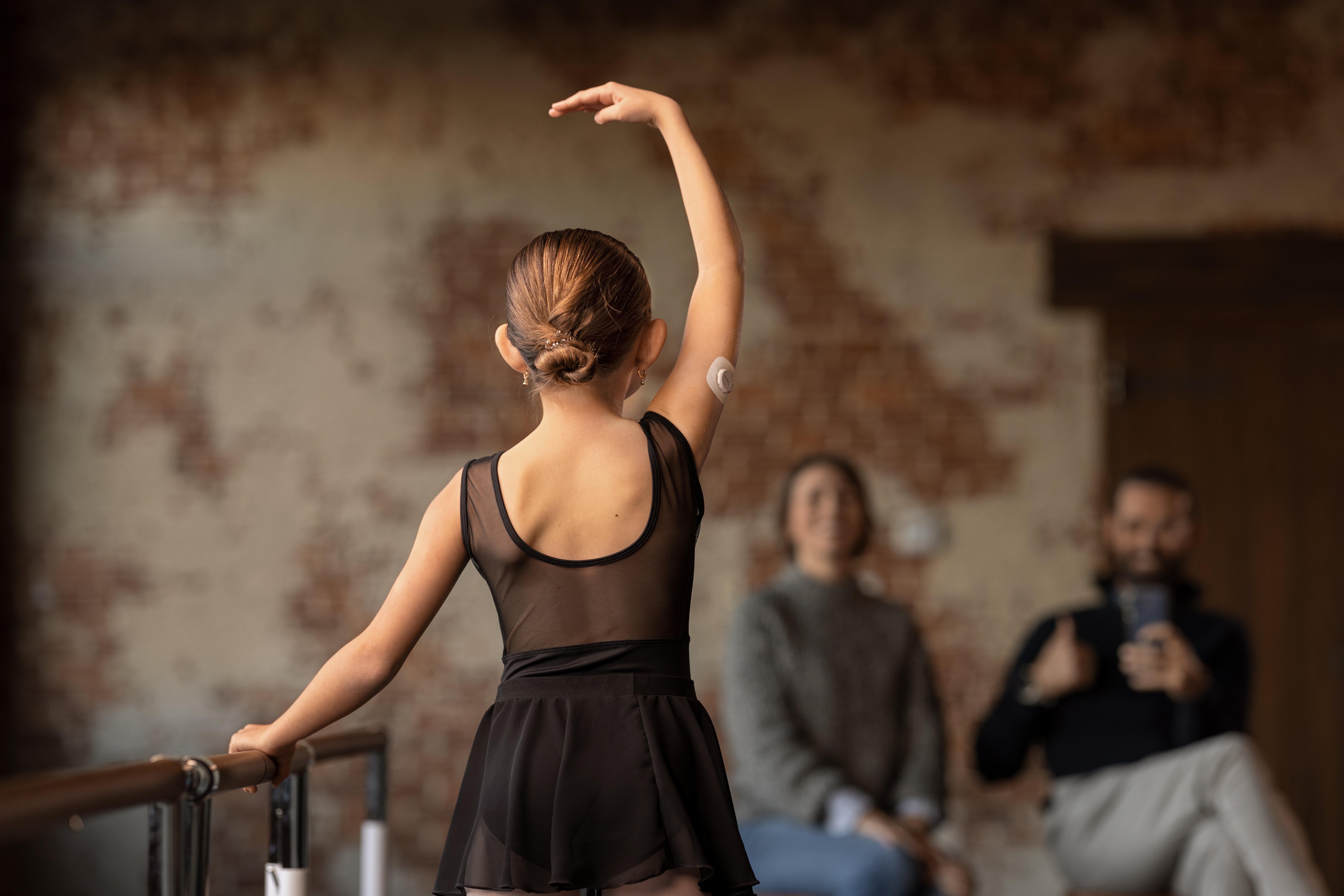 Young ballerina wearing Dexcom G7 CGM
