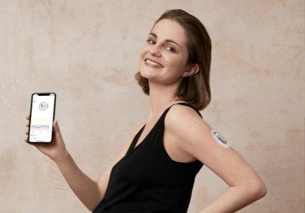 Sitting pregnant woman holding her belly