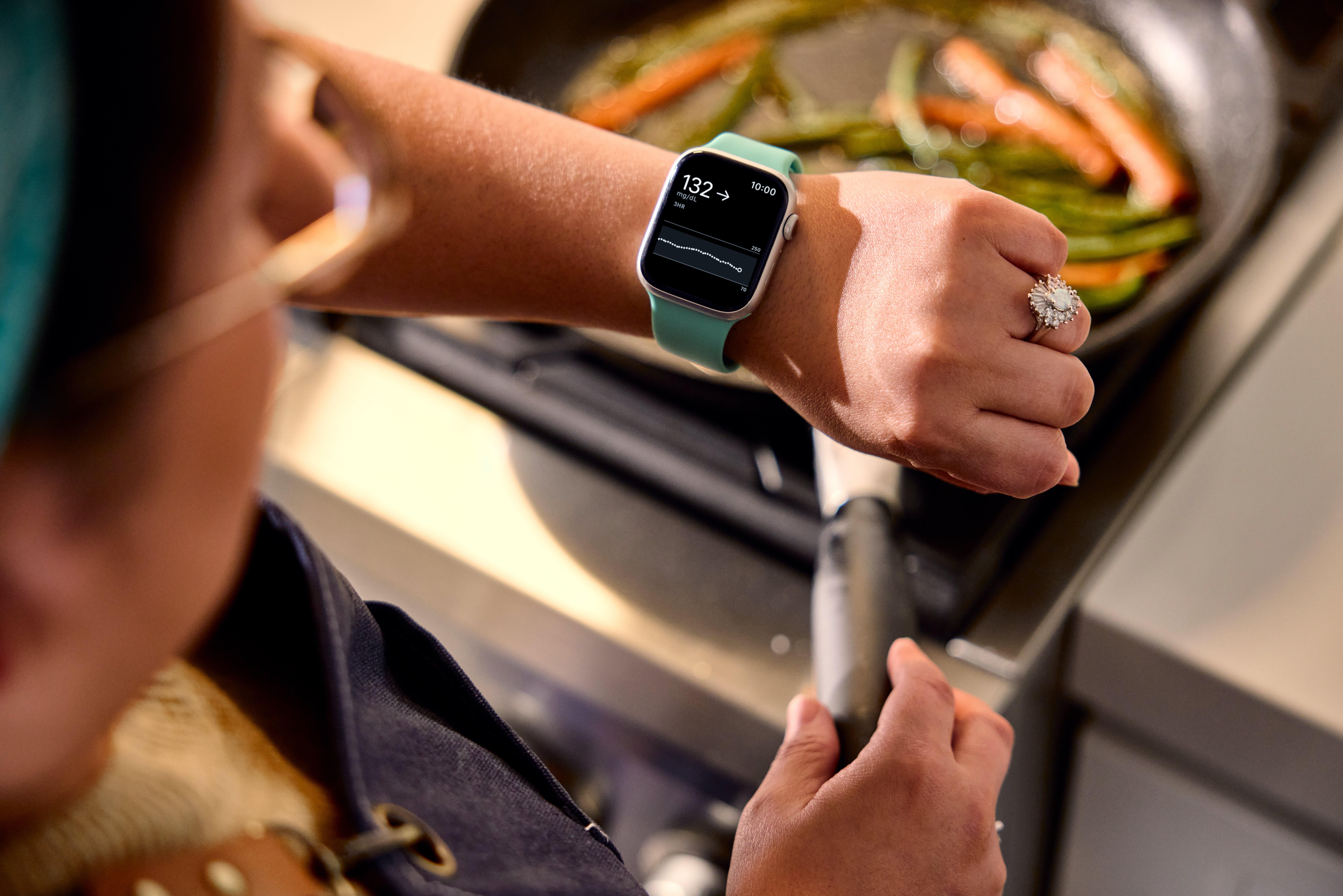 person cooking looking at watch