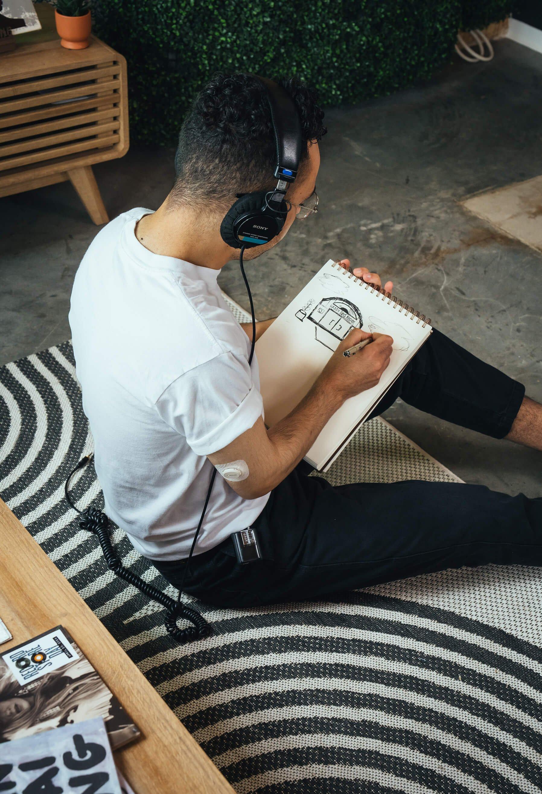 Man with headphones, drawing