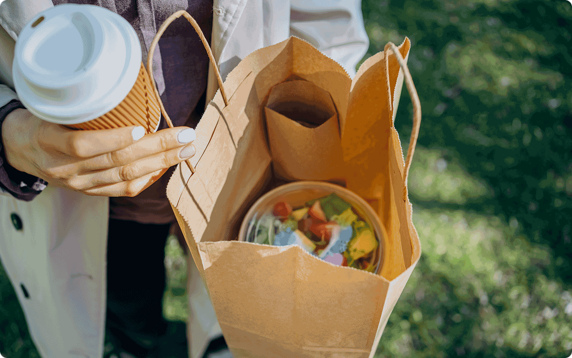 Woman holding a bag with food in it