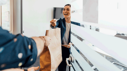 Woman receiving food she had delivered