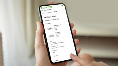 Smartphone with 'Review Order' page for Dexcom products