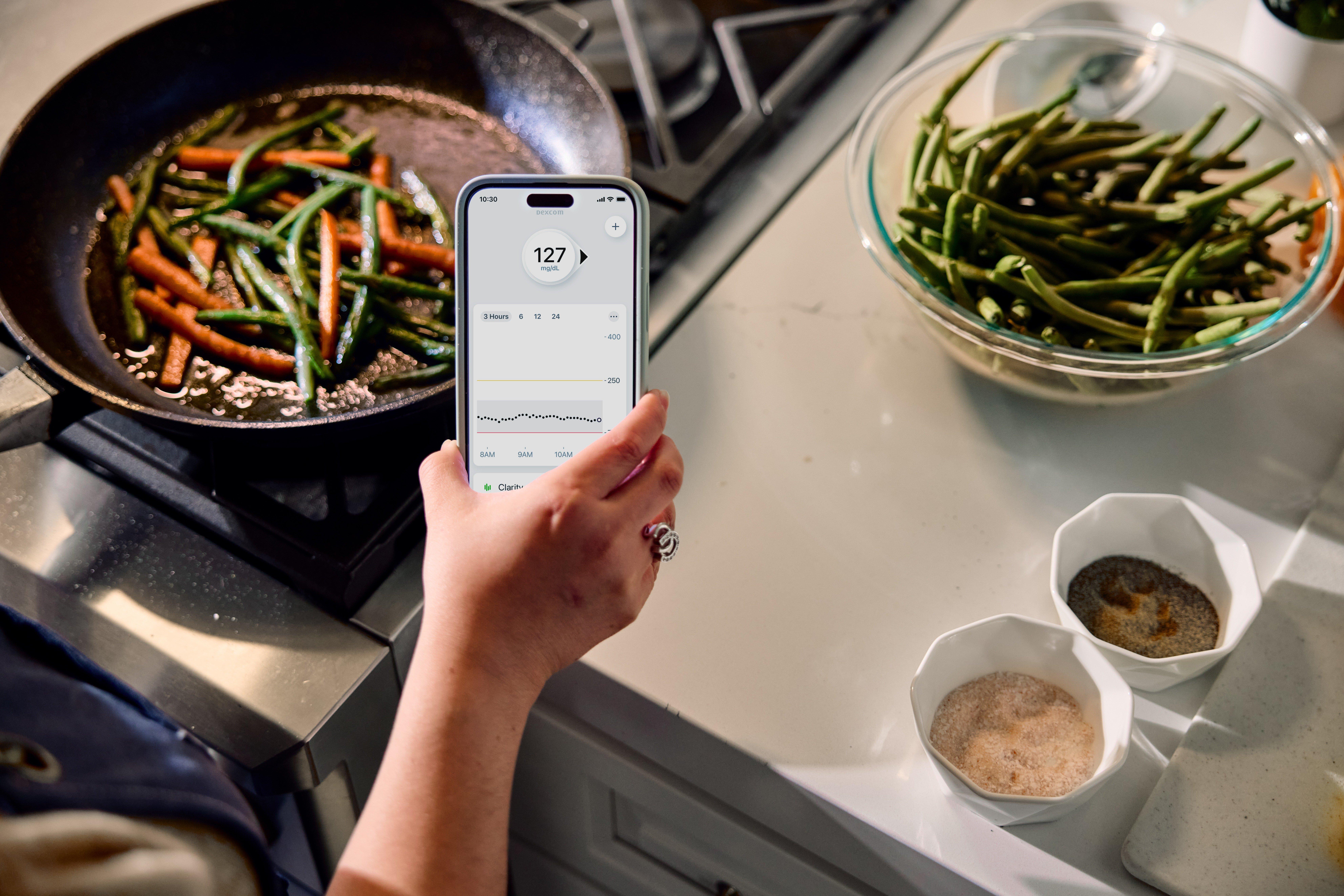 Man looking at smartphone with glucose reading