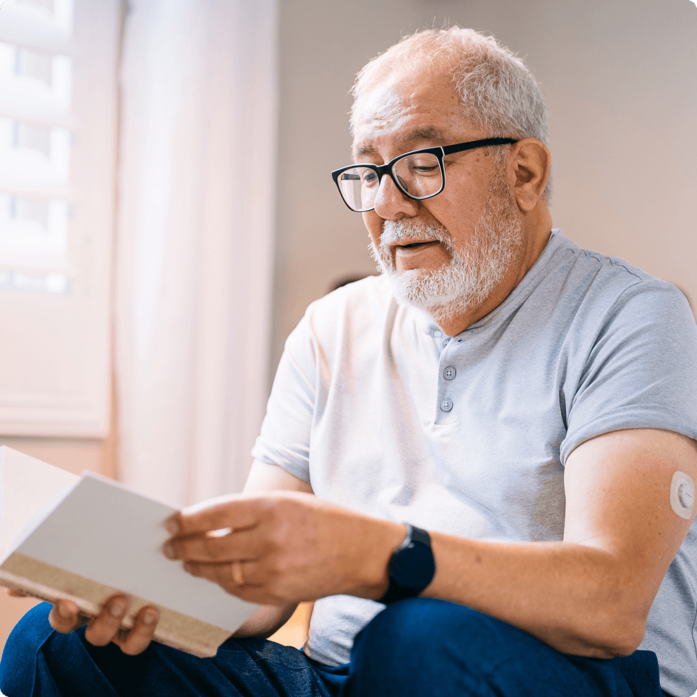 Man sitting down and reading book
