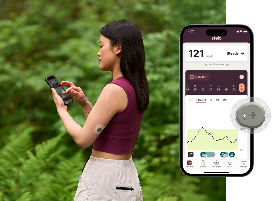 Woman looking at her phone wearing stelo biosensor