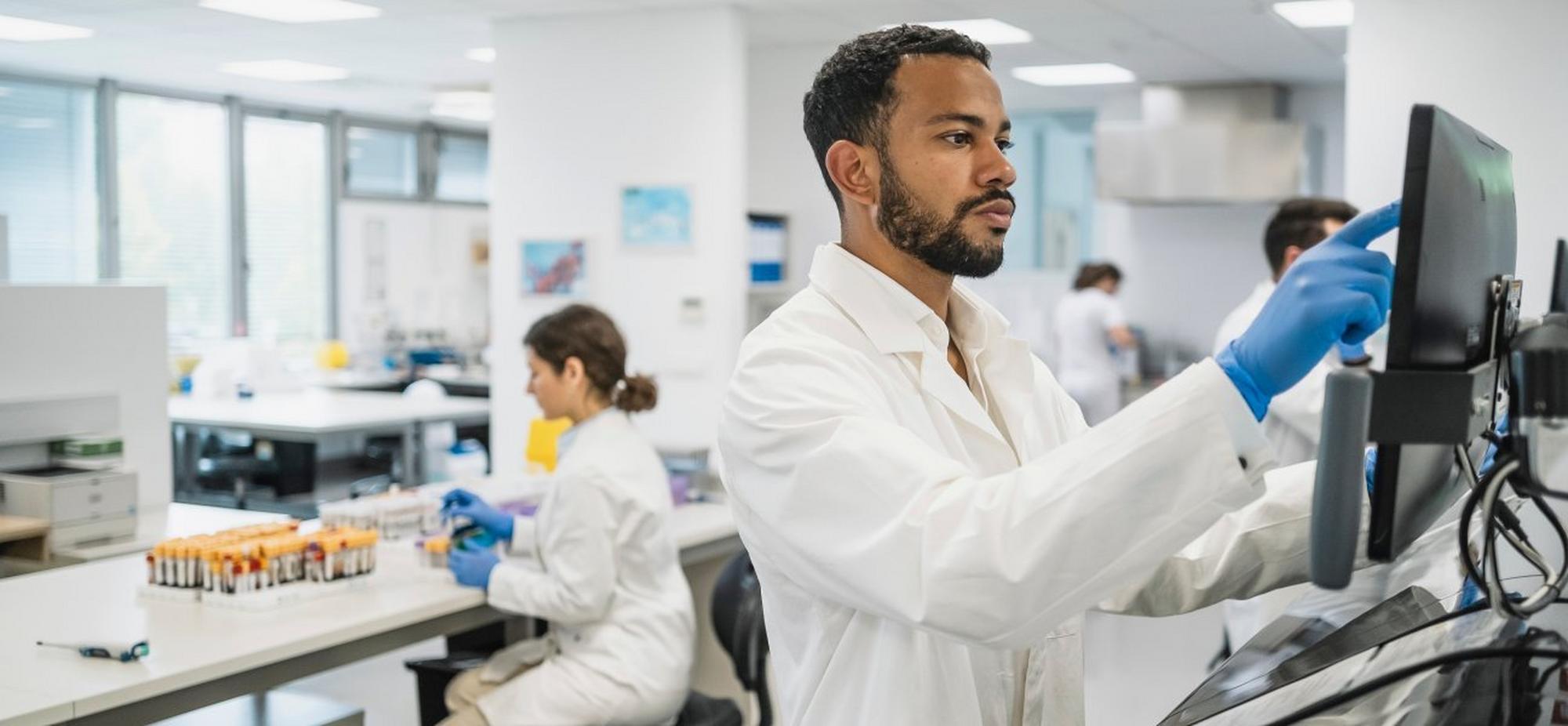 scientist looking at computer monitor