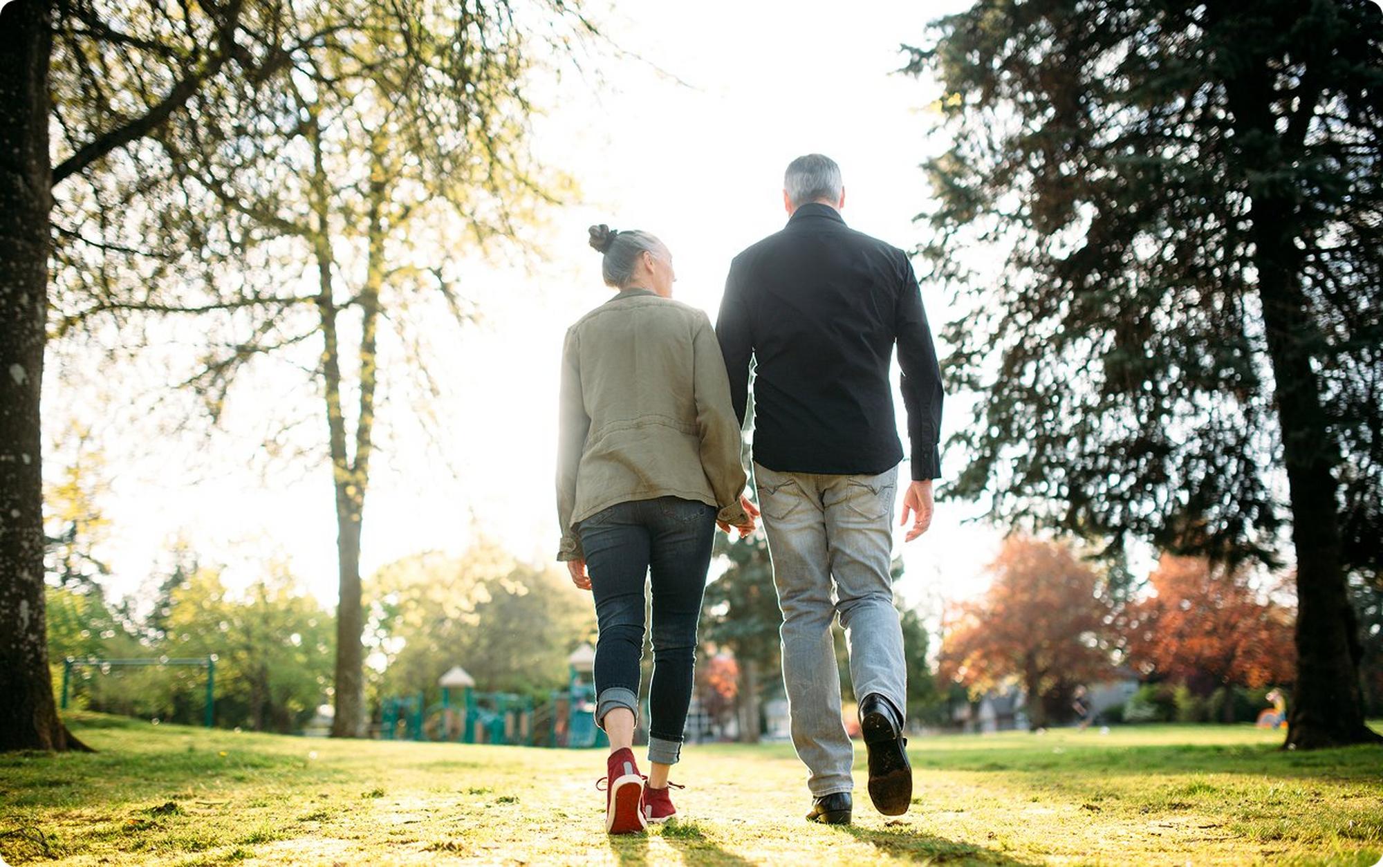 couples walking together on grass