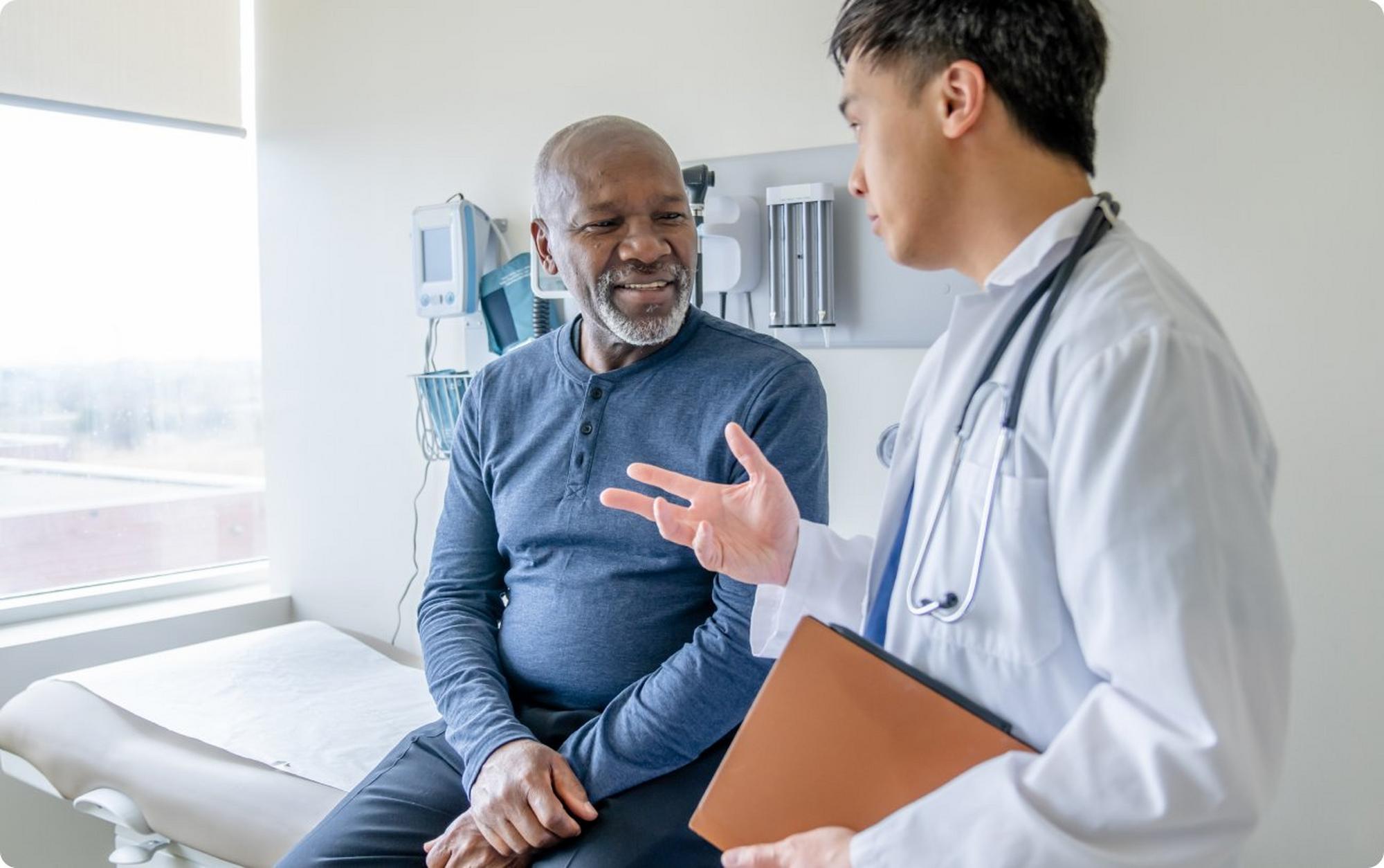 Man and doctor in exam room