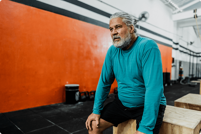 Man sitting in a gym