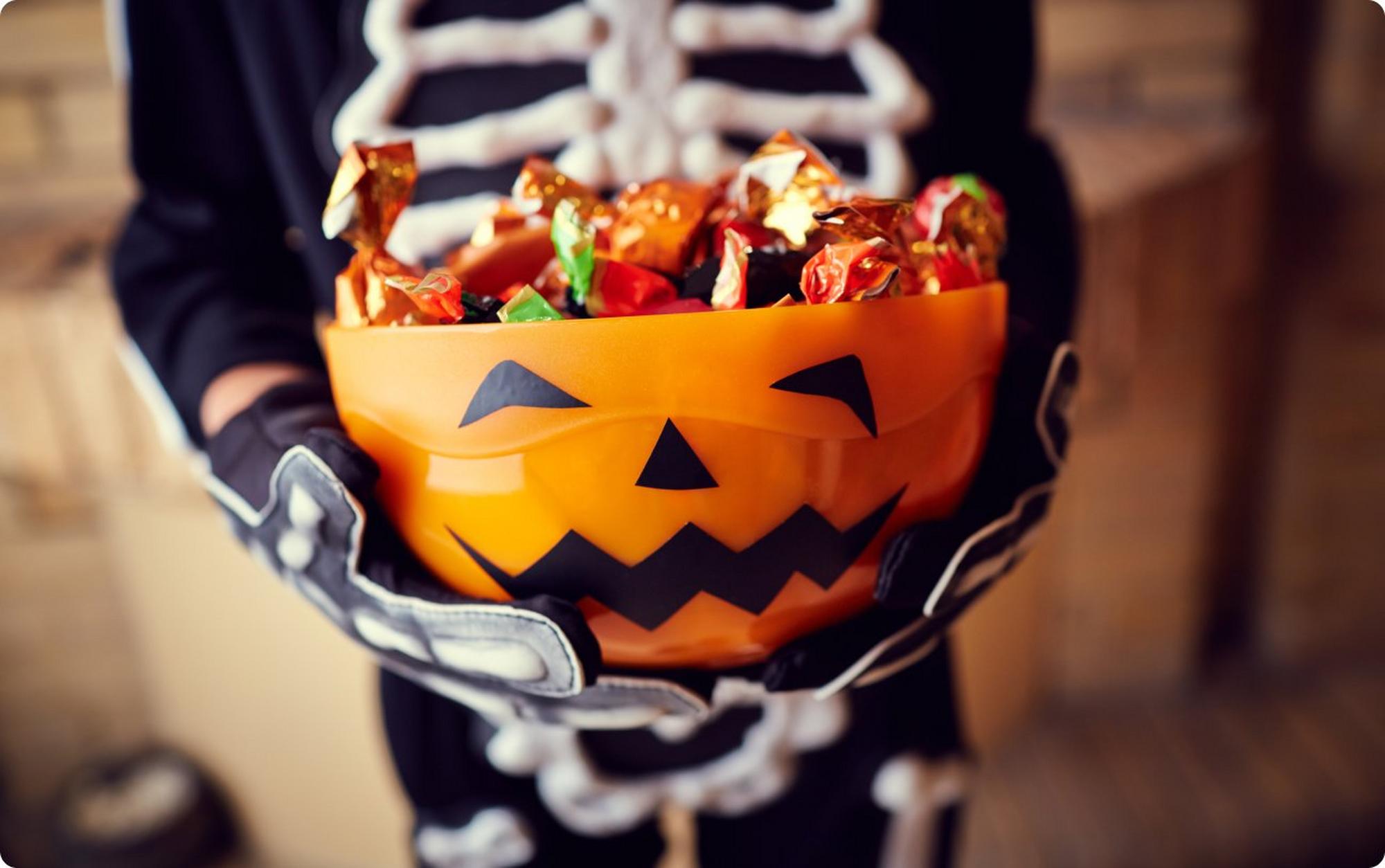 Kid holding halloween candy