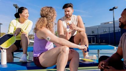 friends taking a break from pickleball