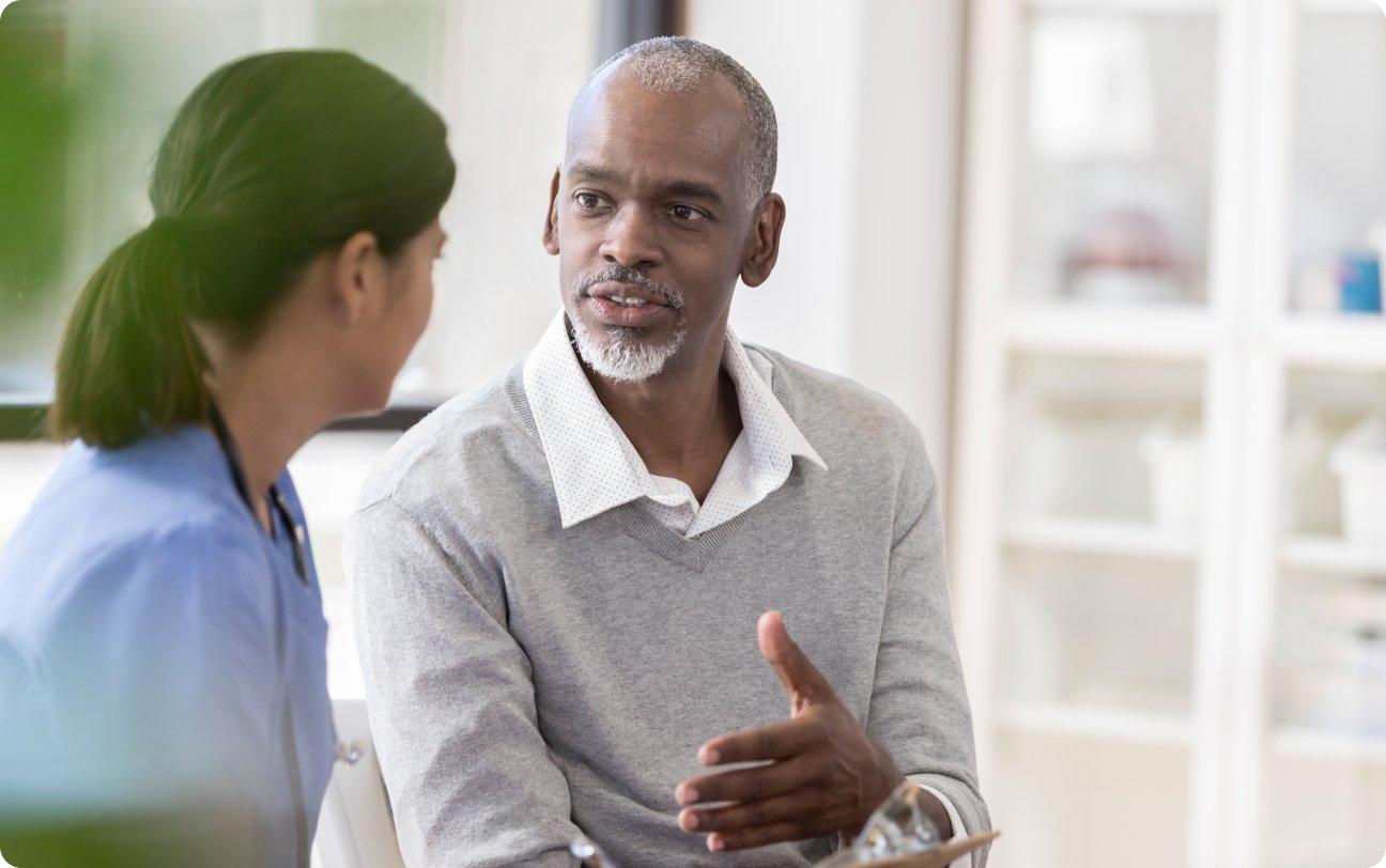 Man talking to doctor